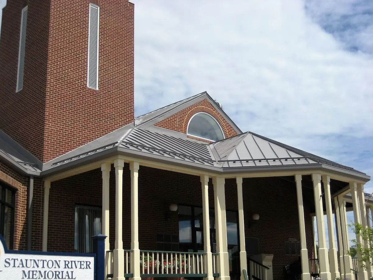 Skilled roofing craftsmen working on a residential roof in New Market
